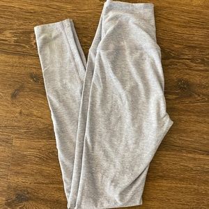 Beyond Yoga grey leggings with Bar Method Logo on leg